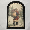 Snowy Forest w/Santa Carrying Sack Print in Med Arch Frame
