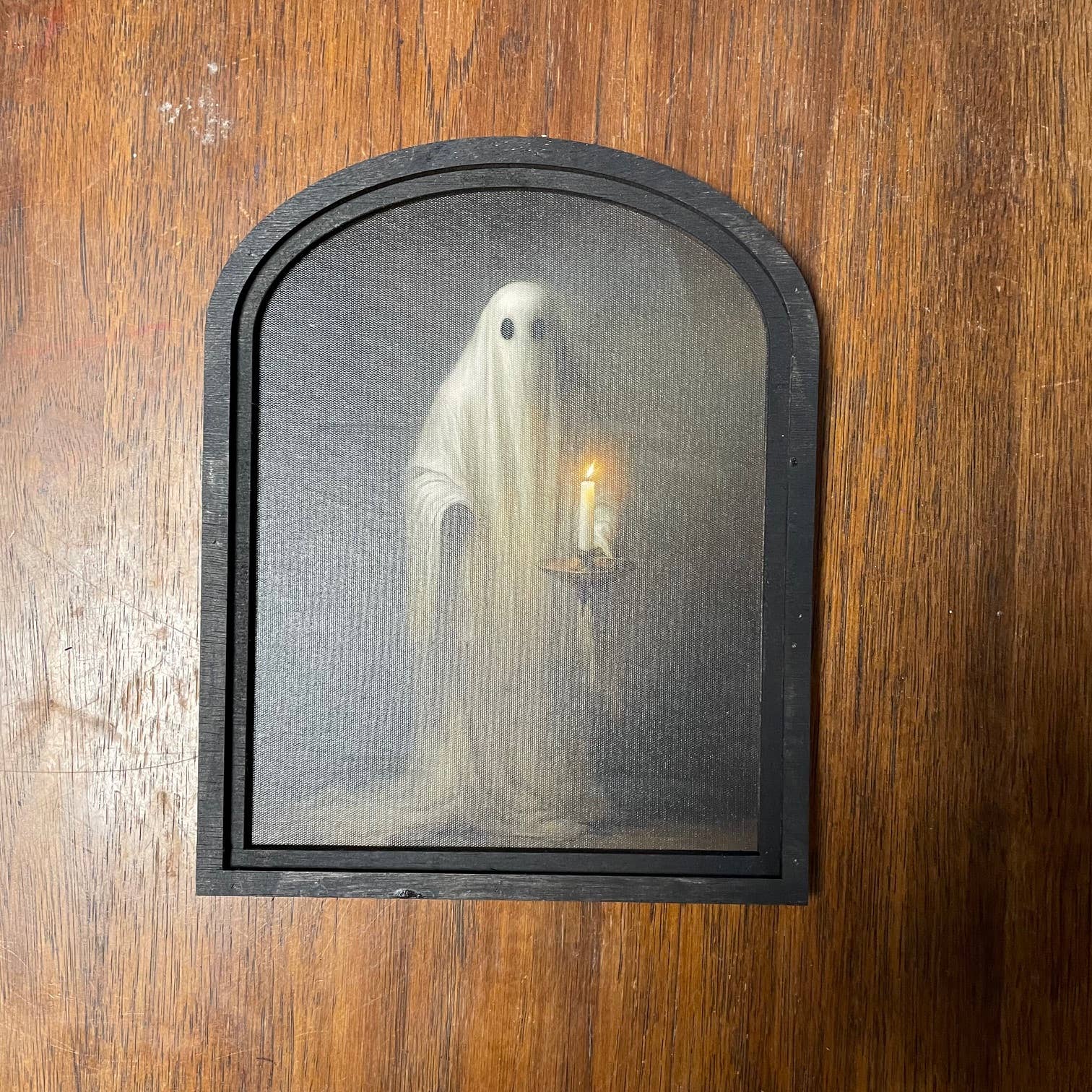 Ghost Holding Candle in Small Arch Frame